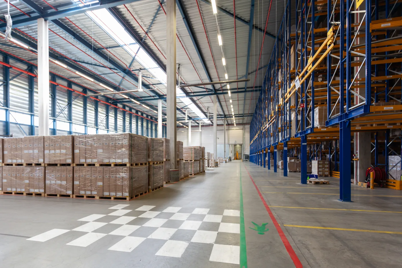 Organised warehouse with clean floors and storage aisles